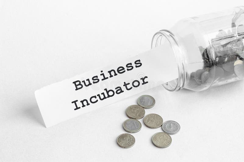 Sticking out of a jar of coins a piece of paper with a text Business IncubatorÂ  on a white background